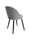 Zdjęcie do “Krzesło Tapicerowane w kolorze szarym na czarnych nogach”.