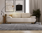 Zdjęcie do “Beżowa welurowa sofa rozkładana na drewnianych nogach ”.